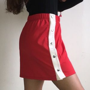 Red skirt with button clips from Urban Outfitters